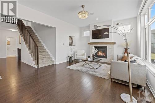 62 Viceroy Mews, Ottawa, ON - Indoor Photo Showing Living Room With Fireplace