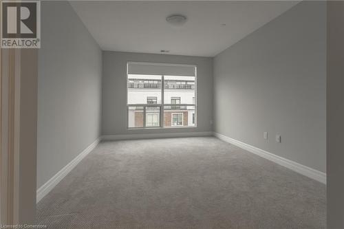 Empty room with carpet flooring - 460 Callaway Road Unit# 910, London, ON - Indoor Photo Showing Other Room