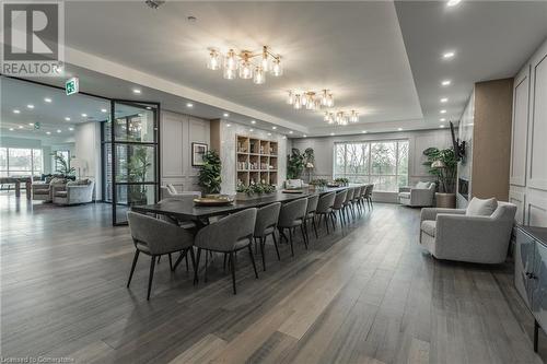 Dining area featuring hardwood / wood-style flooring and a raised ceiling - 460 Callaway Road Unit# 910, London, ON - Indoor