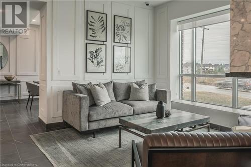 Living room featuring dark tile patterned flooring - 460 Callaway Road Unit# 910, London, ON - Indoor Photo Showing Living Room