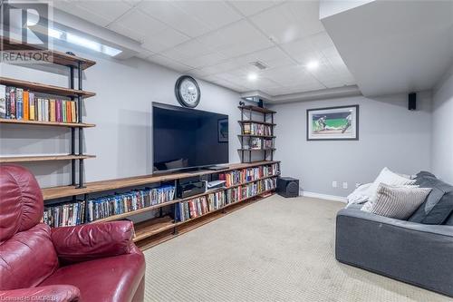 Carpeted living room featuring a paneled ceiling - 259 Littlewood Drive, Oakville, ON - Indoor