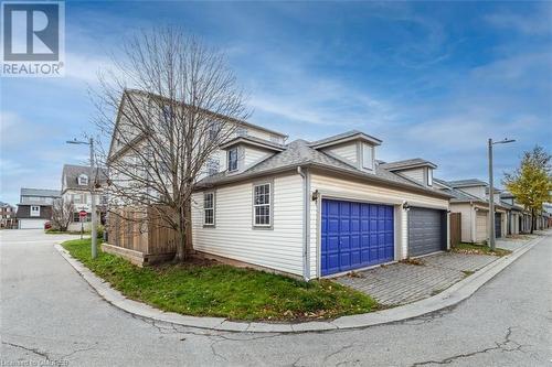 View of side of property featuring a garage - 259 Littlewood Drive, Oakville, ON - Outdoor