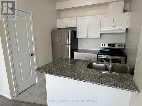 320 - 84 Aspen Springs Drive, Clarington, ON - Indoor Photo Showing Kitchen With Stainless Steel Kitchen With Double Sink