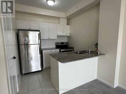 320 - 84 Aspen Springs Drive, Clarington, ON - Indoor Photo Showing Kitchen With Stainless Steel Kitchen With Double Sink