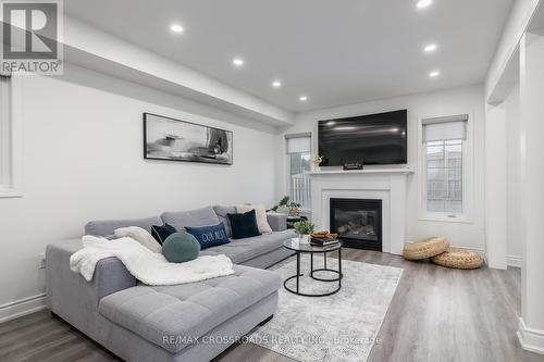 16 Gallimere Court, Whitby, ON - Indoor Photo Showing Living Room With Fireplace