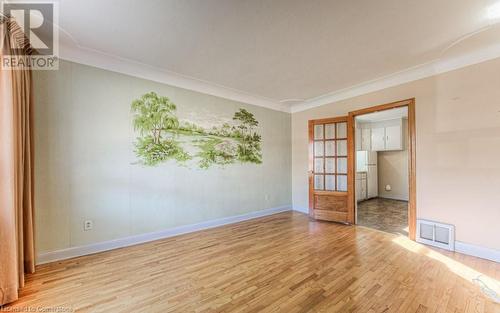 Unfurnished room with light hardwood / wood-style floors and ornamental molding - 55 Ellis Avenue, Kitchener, ON - Indoor Photo Showing Other Room