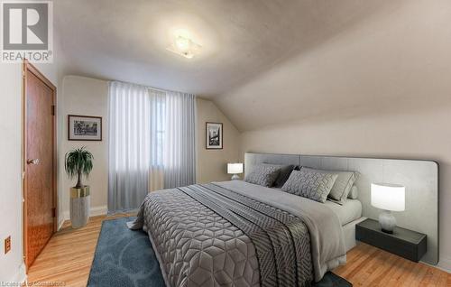 Bedroom featuring light hardwood / wood-style floors and lofted ceiling - 55 Ellis Avenue, Kitchener, ON - Indoor Photo Showing Bedroom