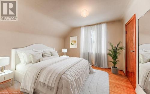 Bedroom featuring light wood-type flooring and vaulted ceiling - 55 Ellis Avenue, Kitchener, ON - Indoor Photo Showing Bedroom