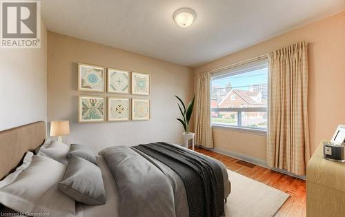 Bedroom with light hardwood / wood-style floors - 55 Ellis Avenue, Kitchener, ON - Indoor Photo Showing Bedroom