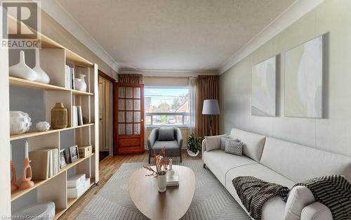 Family room with a textured ceiling, light wood-type flooring, and crown molding - 55 Ellis Avenue, Kitchener, ON - Indoor Photo Showing Living Room