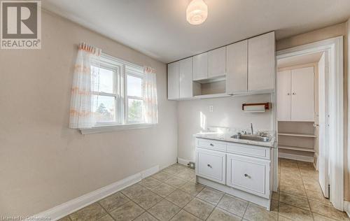 Kitchen with sink and white cabinets - 55 Ellis Avenue, Kitchener, ON - Indoor