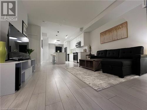 Living room featuring light hardwood / wood-style floors - 55 Duke Street W Unit# 1607, Kitchener, ON - Indoor Photo Showing Living Room