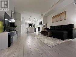 Living room featuring light hardwood / wood-style floors - 