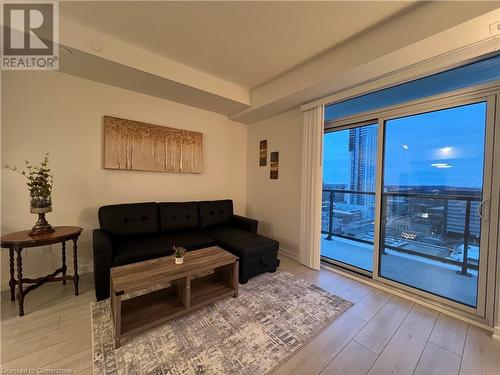 Living room featuring light hardwood / wood-style floors - 55 Duke Street W Unit# 1607, Kitchener, ON - Indoor