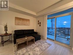 Living room featuring light hardwood / wood-style floors - 