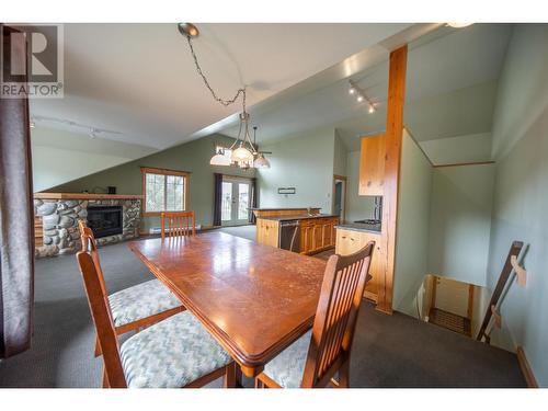 33 Rivermount Place Unit# 201D, Fernie, BC - Indoor Photo Showing Dining Room With Fireplace