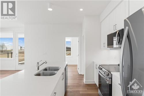 655 Wanaki Road Unit#101, Ottawa, ON - Indoor Photo Showing Kitchen With Double Sink With Upgraded Kitchen