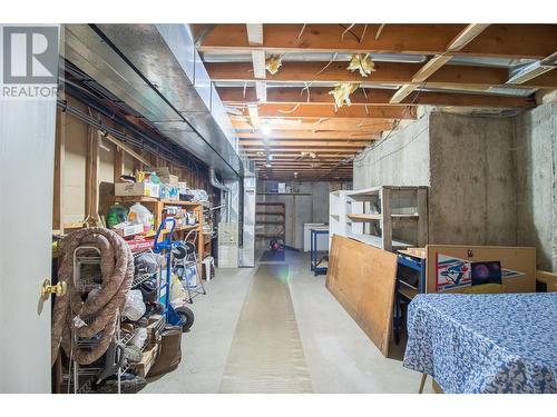 Utility Room: Ample storage or work area. - 1053 Aldon Road, Kelowna, BC - Indoor Photo Showing Basement