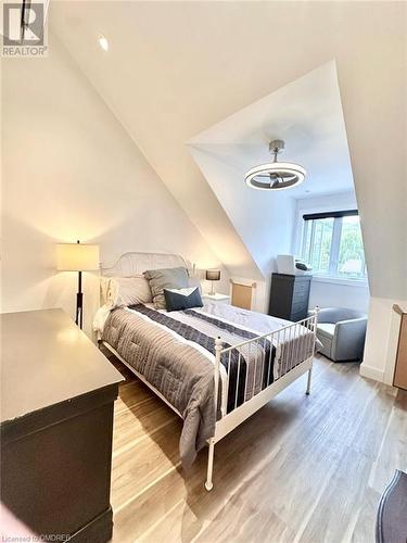 Bedroom featuring light hardwood / wood-style floors and lofted ceiling - 796363 Grey 19 Road, The Blue Mountains, ON - Indoor Photo Showing Bedroom