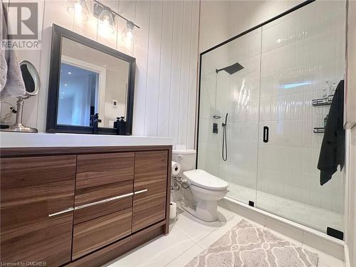 Bathroom with tile patterned flooring, vanity, toilet, and an enclosed shower - 796363 Grey 19 Road, The Blue Mountains, ON - Indoor Photo Showing Bathroom