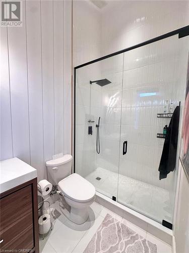 Bathroom with tile patterned floors, vanity, toilet, and a shower with door - 796363 Grey 19 Road, The Blue Mountains, ON - Indoor Photo Showing Bathroom