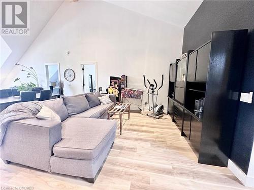 Living room featuring high vaulted ceiling and light hardwood / wood-style flooring - 796363 Grey 19 Road, The Blue Mountains, ON - Indoor