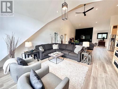 Living room with high vaulted ceiling, light hardwood / wood-style flooring, and ceiling fan - 796363 Grey 19 Road, The Blue Mountains, ON - Indoor Photo Showing Living Room