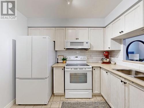 917 - 1700 Eglinton Avenue E, Toronto, ON - Indoor Photo Showing Kitchen With Double Sink