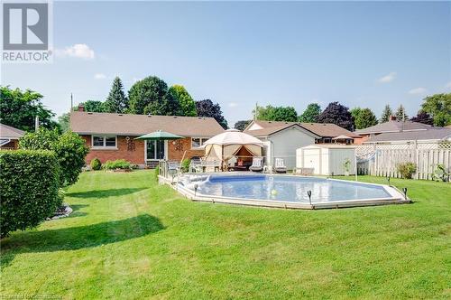 215 Brenda Crescent, Woodstock, ON - Outdoor With In Ground Pool With Backyard