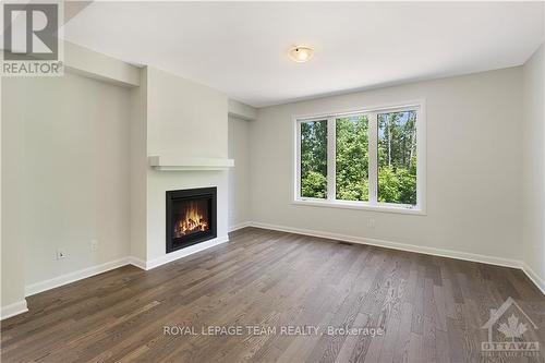 331 Elsie Macgill Walk, Ottawa, ON - Indoor Photo Showing Living Room With Fireplace