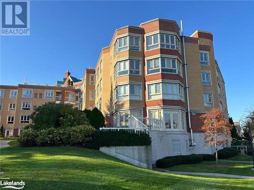 View of building rear exterior - 16 Raglan Street E Unit# 211, Collingwood, ON - Outdoor With Facade