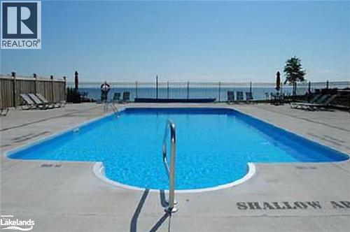 View of pool with a patio area and a water view - 16 Raglan Street E Unit# 211, Collingwood, ON - Outdoor With In Ground Pool