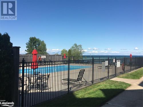 View of swimming pool with a water view - 16 Raglan Street E Unit# 211, Collingwood, ON - Outdoor