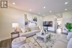 Living room featuring wood-type flooring - 