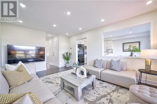 Living room featuring light wood-type flooring - 1145 Riddell Crescent, Hamilton, ON - Indoor Photo Showing Living Room