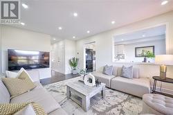 Living room featuring light wood-type flooring - 