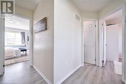 Hallway featuring light hardwood / wood-style flooring - 