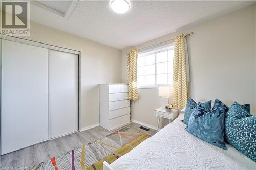 Bedroom featuring a closet and light hardwood / wood-style flooring - 1145 Riddell Crescent, Hamilton, ON - Indoor Photo Showing Bedroom