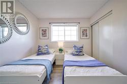 Bedroom featuring dark hardwood / wood-style floors and a closet - 