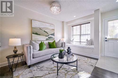 Living room with hardwood / wood-style flooring - 1145 Riddell Crescent, Hamilton, ON - Indoor Photo Showing Living Room