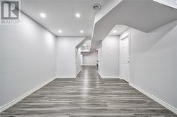 Hall featuring dark hardwood / wood-style flooring - 