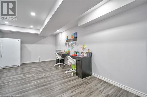 Bar featuring wood-type flooring - 1145 Riddell Crescent, Hamilton, ON - Indoor Photo Showing Other Room