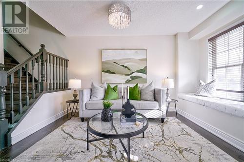 Living area featuring a chandelier and hardwood / wood-style flooring - 1145 Riddell Crescent, Hamilton, ON - Indoor