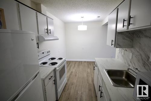 8311 29 Av Nw, Edmonton, AB - Indoor Photo Showing Kitchen With Double Sink