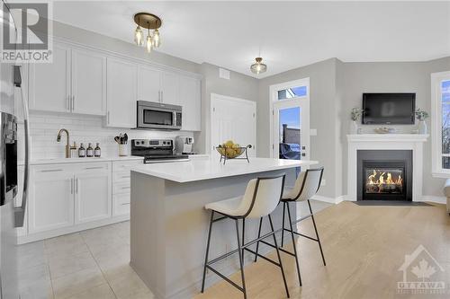 173 Mojave Crescent, Stittsville, ON - Indoor Photo Showing Kitchen With Fireplace