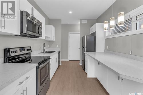 B 3905 James Hill Road, Regina, SK - Indoor Photo Showing Kitchen With Stainless Steel Kitchen With Double Sink