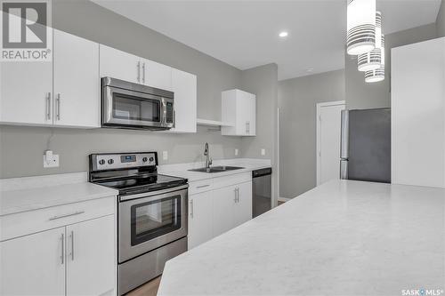 B 3905 James Hill Road, Regina, SK - Indoor Photo Showing Kitchen With Stainless Steel Kitchen With Double Sink