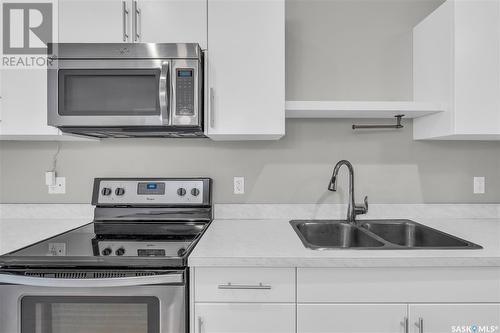 B 3905 James Hill Road, Regina, SK - Indoor Photo Showing Kitchen With Double Sink