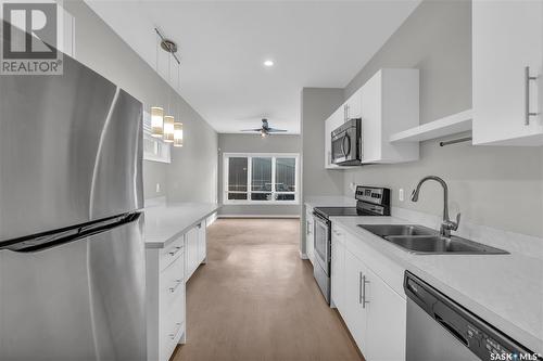 B 3905 James Hill Road, Regina, SK - Indoor Photo Showing Kitchen With Stainless Steel Kitchen With Double Sink With Upgraded Kitchen