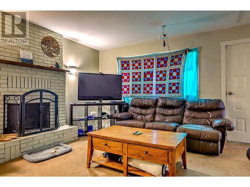 3035 Pleasant Valley Road, Armstrong, BC - Indoor Photo Showing Living Room With Fireplace